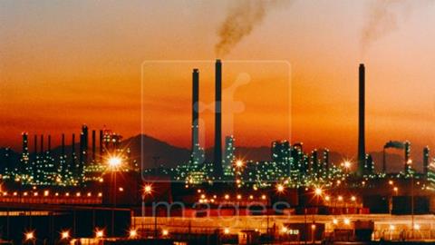 Saudi oil refinery at dusk